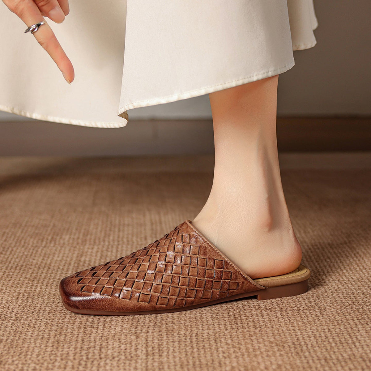 Mule de piel auténtica tejida sin cordones Amani